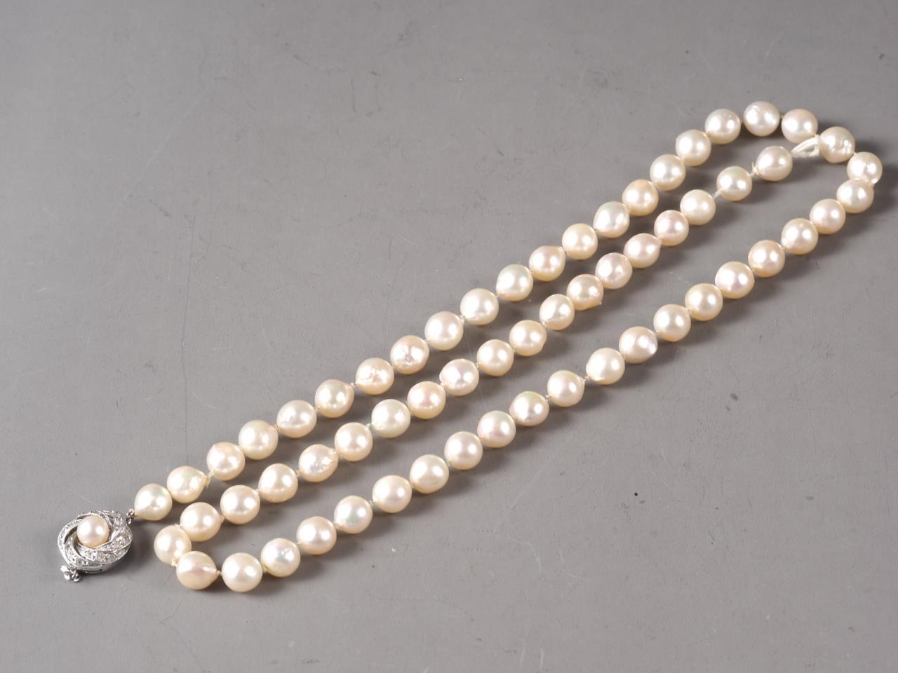 A single strand pearl necklace with white metal, stamped 925, clasp, set pearl and CZ, pearls approx