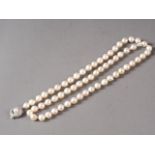 A single strand pearl necklace with white metal, stamped 925, clasp, set pearl and CZ, pearls approx