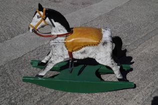 A handmade wooden rocking horse, 33" wide