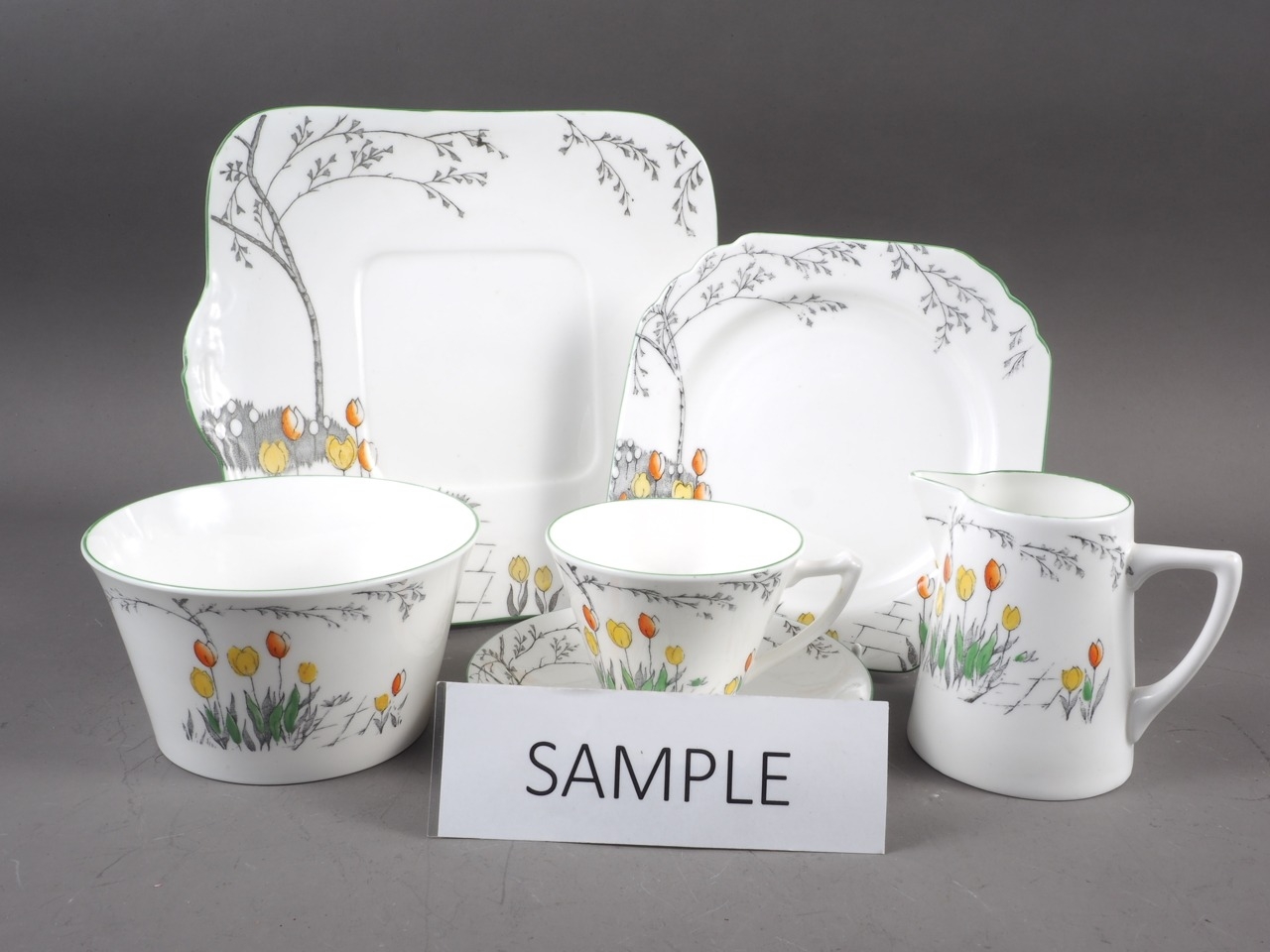 A Heathcote "Best Bone" china tulip pattern teaset for six (no teapot)