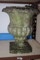Two turned hardstone garden urns, on square bases, tallest 12" high, and one other (for repair)