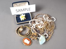 A selection of costume jewellery, necklaces, watches, etc