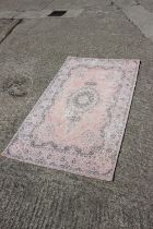 A John Lewis pink Jaipur rug, 35 1/2" x 59" approx, a Habitat wool shag pile rug, 31 1/2" x 51"