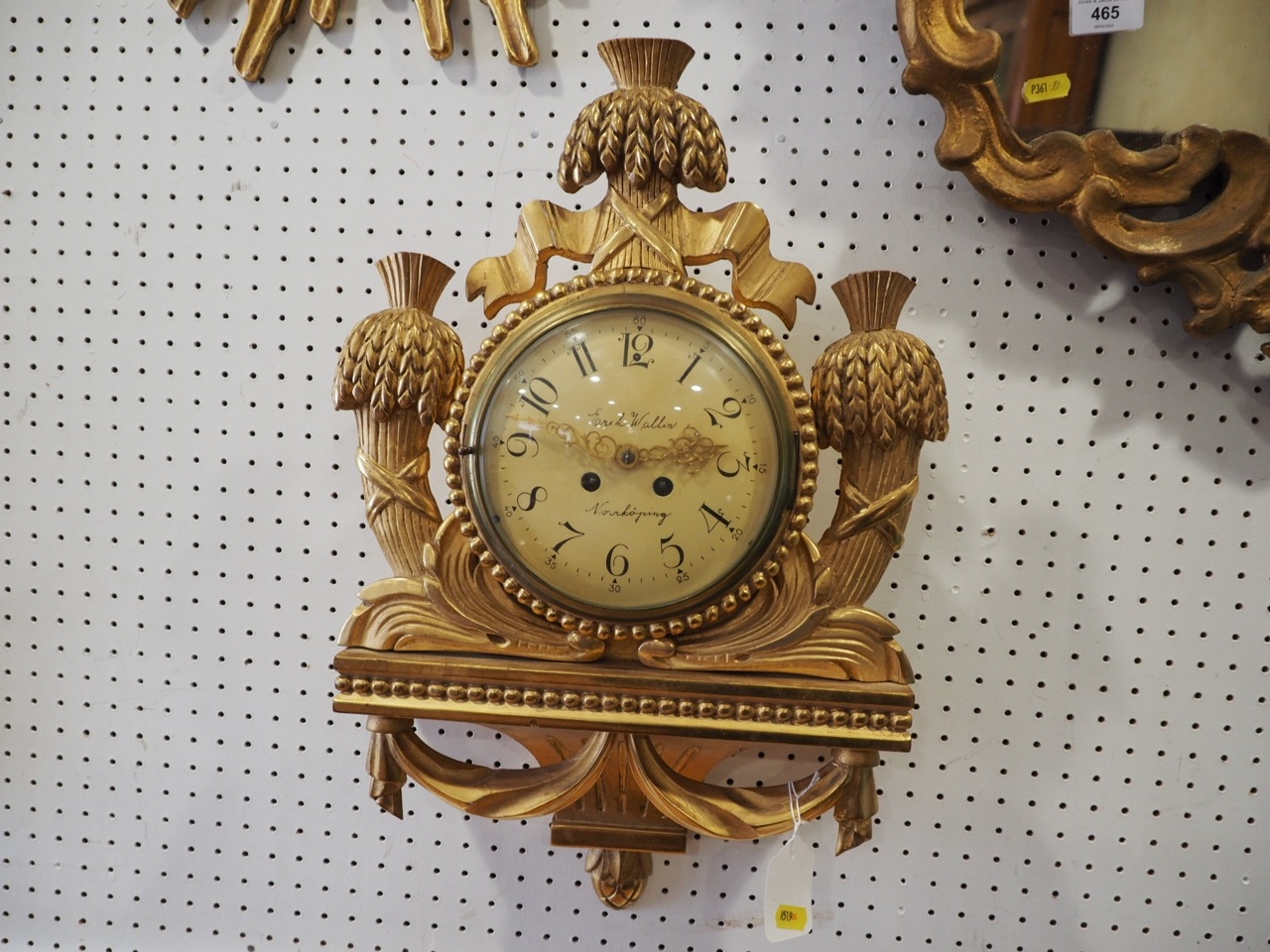 A 19th century Scandinavian carved gilt wood cased bracket clock with eight-day striking movement,