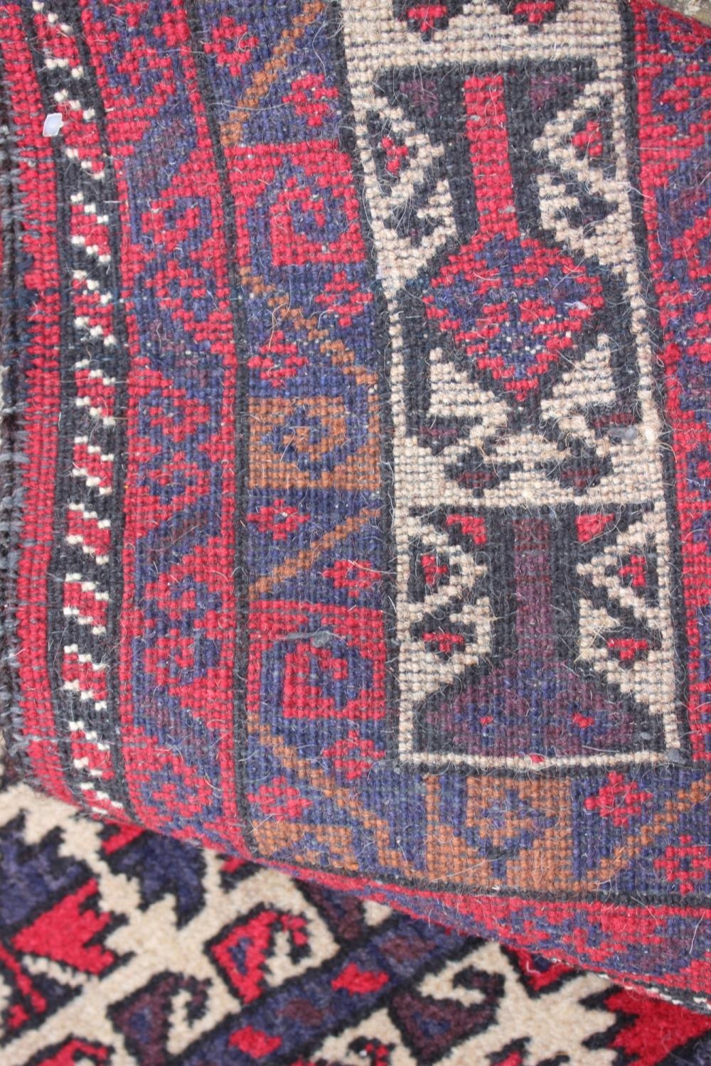 A Bokhara prayer rug of traditional design in shades of red, blue, brown, grey and natural, 32" wide - Image 2 of 3