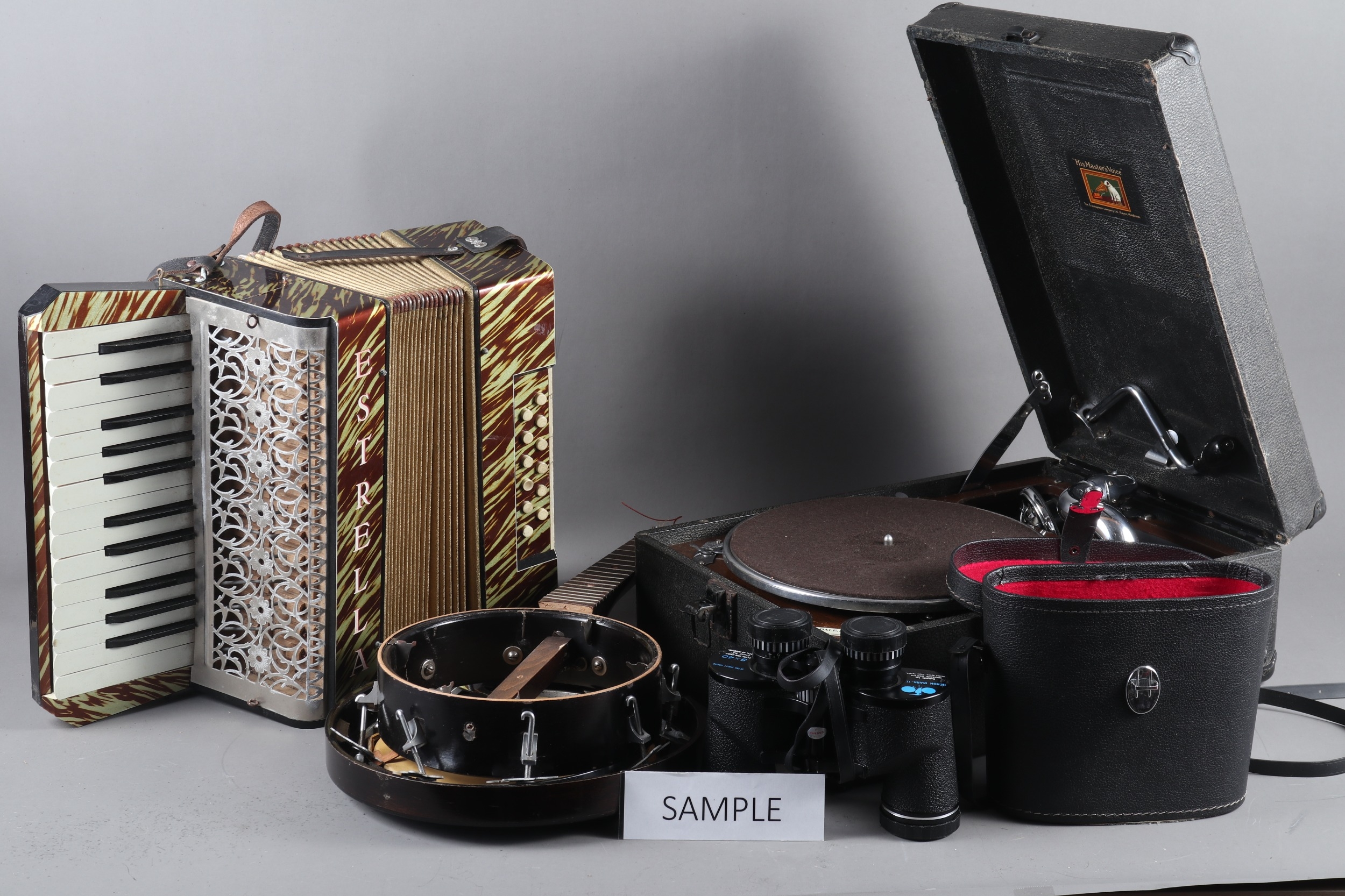 An HMV record player, an Estrella accordion, in case, a Melody-like banjolele (needs re-