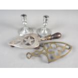 A pair of pewter candlesticks, on hexagonal bases, 4 3/4" high, a brass iron trivet stand and