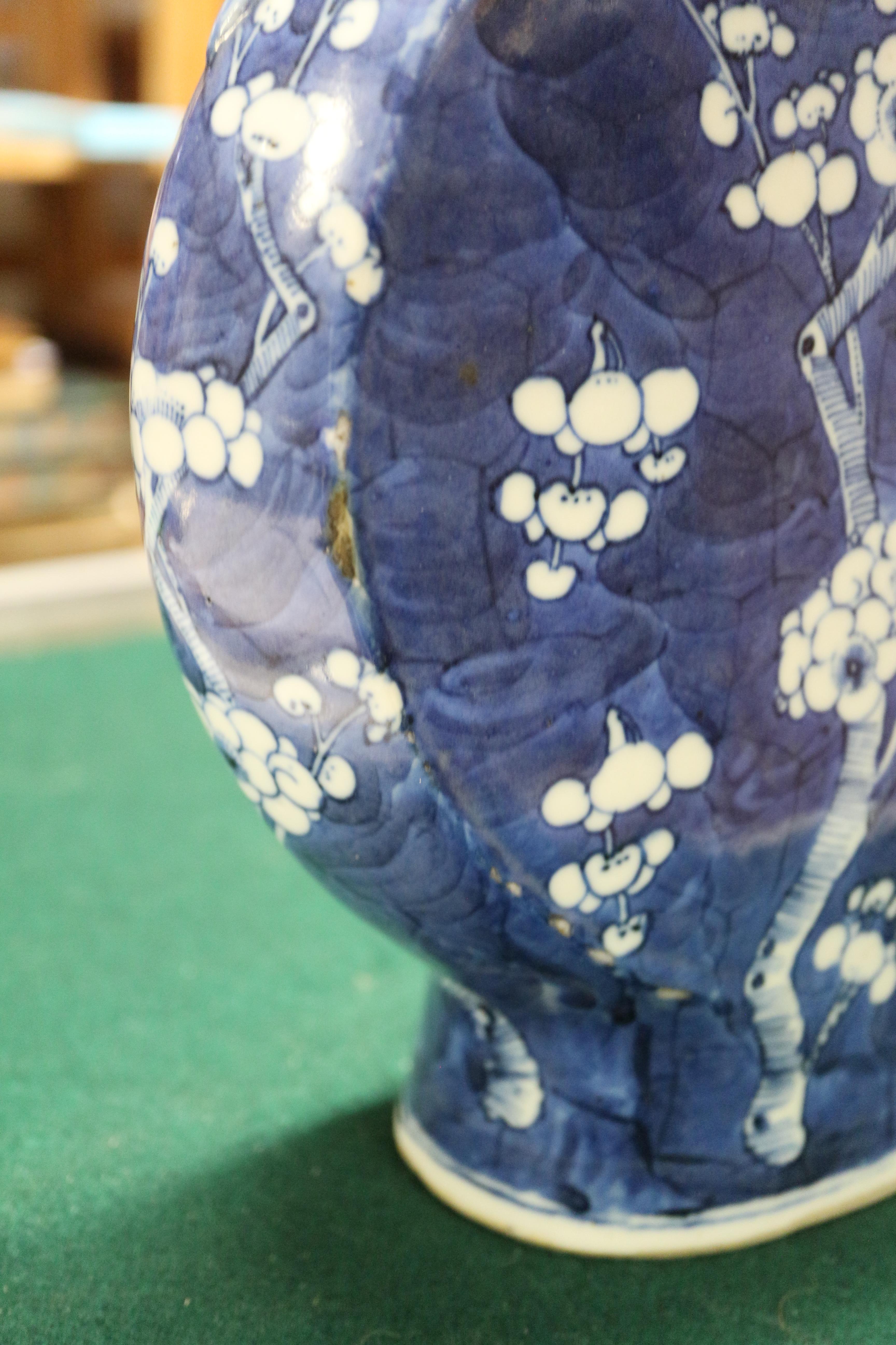 A pair of Chinese blue and white moon flasks with relief dragon handles and prunus decoration, - Image 14 of 27