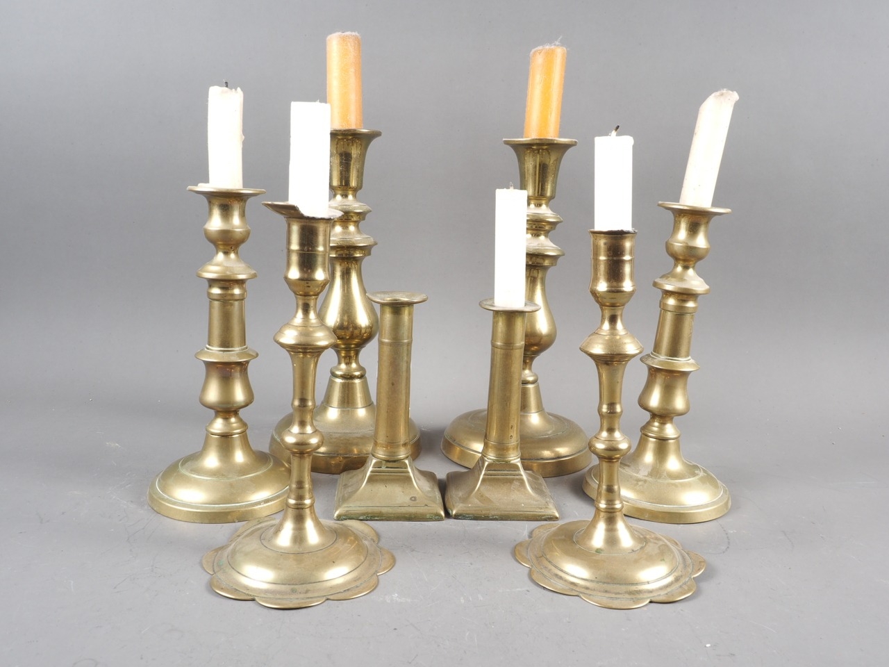 A pair of 18th century brass petal base candlesticks, and three other pairs of brass candlesticks - Image 2 of 2