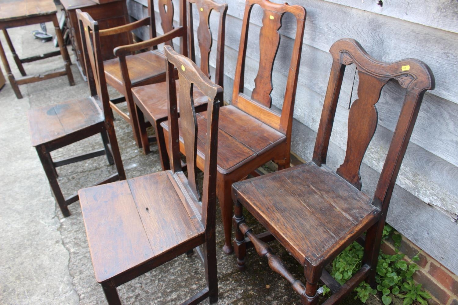 A Harlequin set of six 18th century oak dining chairs with panel seat, on stretchered supports (5+1) - Image 3 of 3