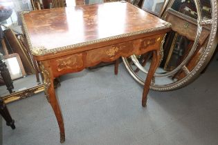 A Louis XVI design mahogany and marquetry work fold-over top card table with brass mounts, fitted
