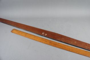 An artist's Winsor and Newton mahogany and ebony rule and a scale rule (damages)