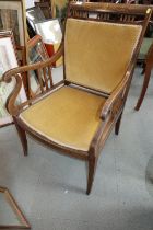 An Edwardian walnut and inlaid open armchair with padded seat and back, on square taper supports