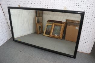 An ebonised framed wall mirror, 20" x 36", and a pair of gilt framed wall mirrors, 41" x 11"