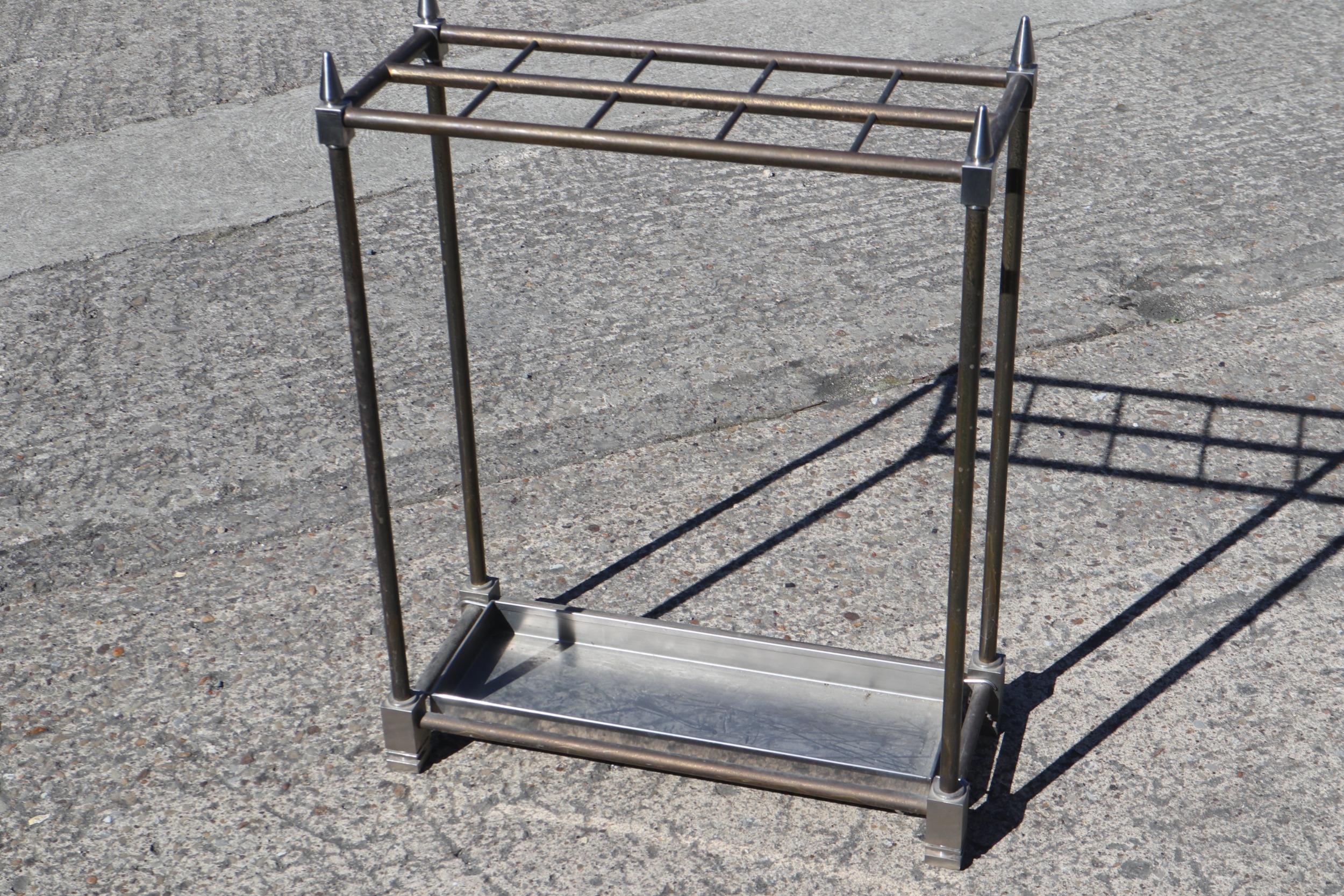 A contemporary steel umbrella stand, 20 1/2" wide x 26 1/2" high