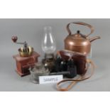 A 19th century brass warming pan, a copper kettle, a coffee grinder, a pair of binoculars and