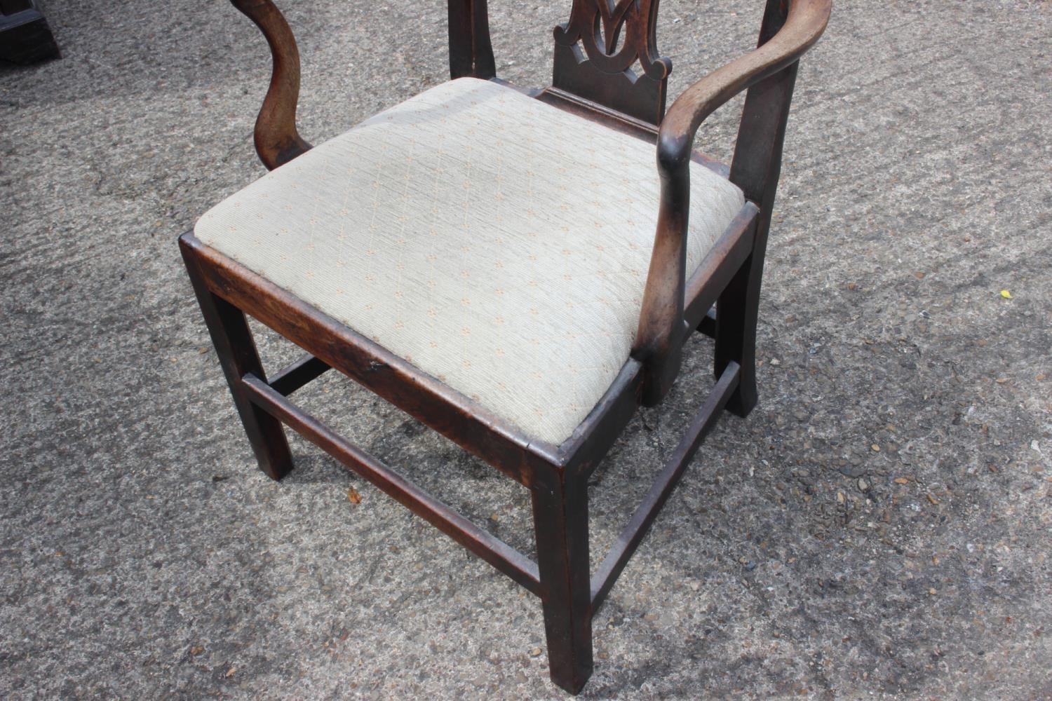 A Georgian provincial carver chair of Chippendale design with drop-in seat, on stretchered supports - Image 2 of 2