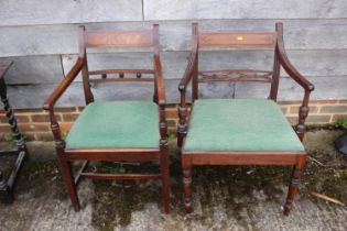 Two 19th century mahogany bar back carver dining chairs with drop-in seats, on turned and
