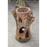 A 19th century terracotta "tree trunk" strawberry planter, 24 1/2" high (damages)