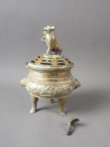 A Chinese brass censor and cover with panelled animal and landscape decoration and Dog of Fo finial,
