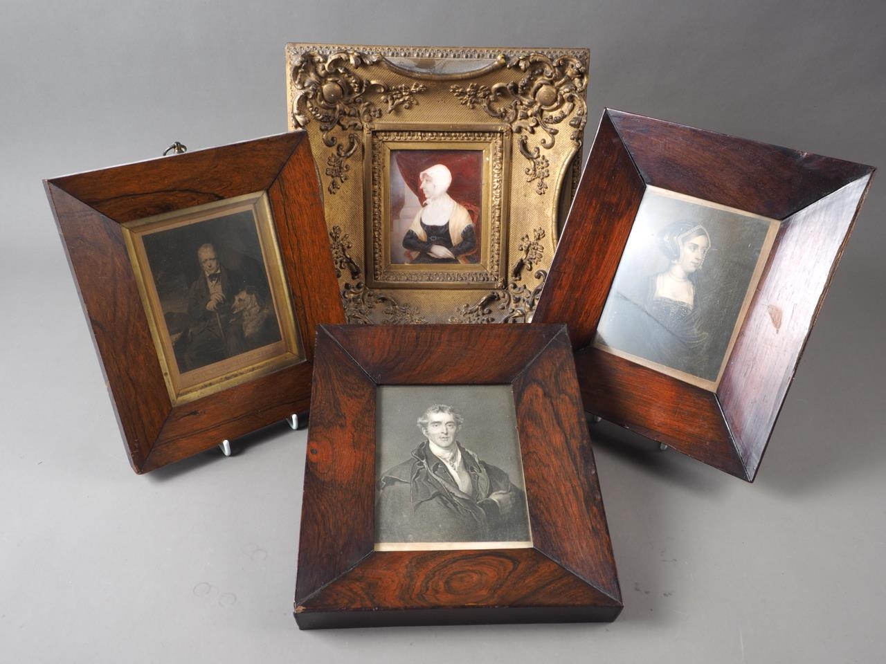 A pair of 19th century prints, portrait busts of a man and a woman, in rosewood strip frames,