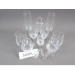 A quantity of glassware, including tumblers, champagne flutes, brandy balloons and other table glass