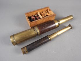 A 19th century brass and mahogany, three-draw telescope, by Dolland, a pocket two-draw telescope and