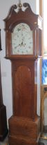 A late 18th century/early 19th century provincial quarter cut oak long case clock with swan neck