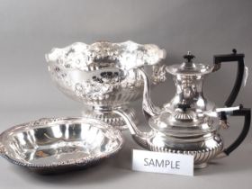 A silver plated punch bowl, a pair of plated trays, a ham stand and other plate
