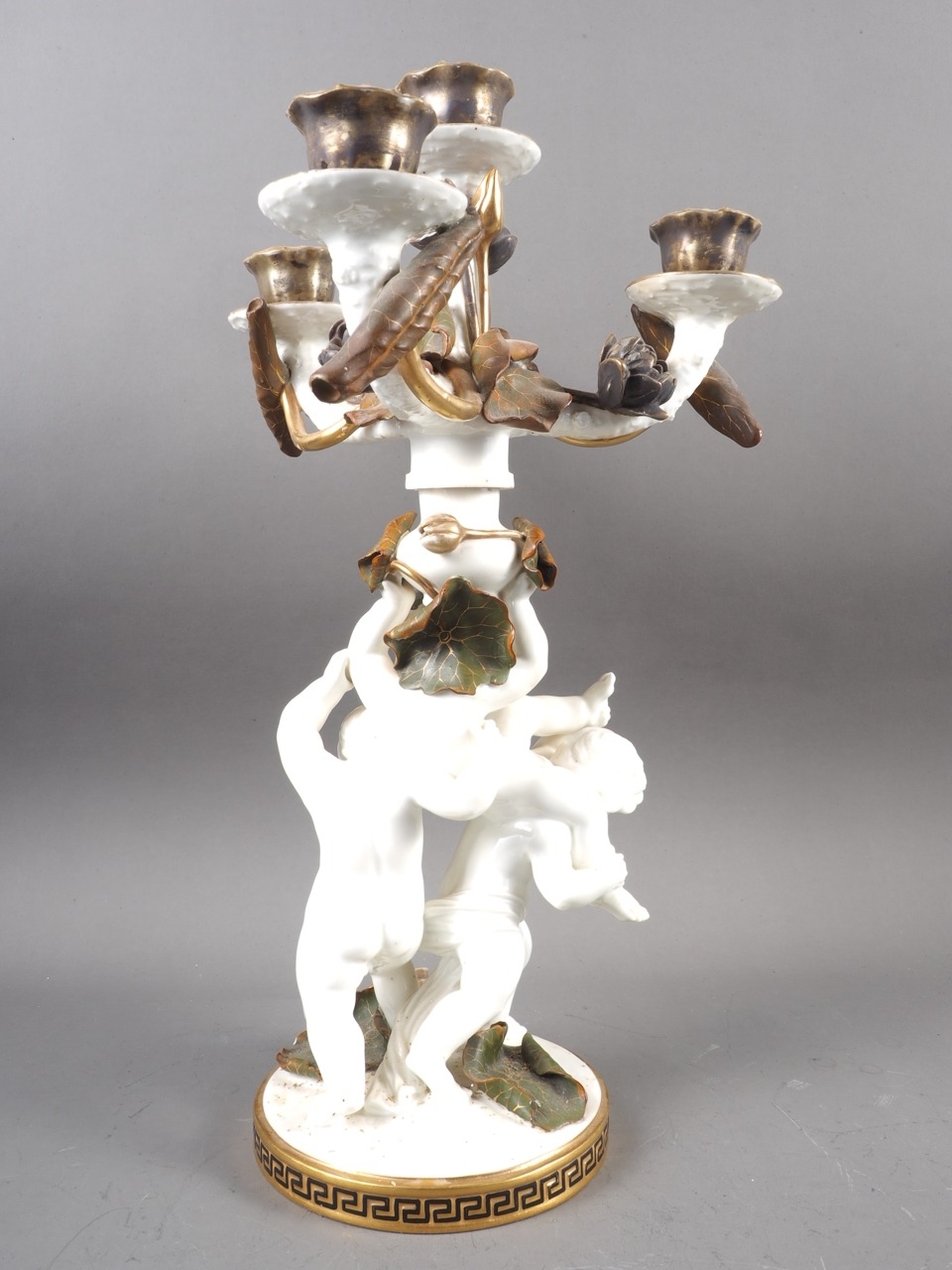 A 19th century Moores three-branch four-light candelabrum of cherub and floral design with gilt - Image 2 of 3