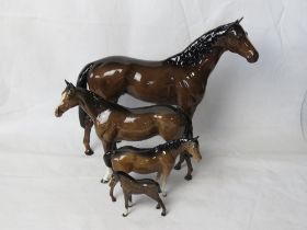 A set of four graduated Beswick horses.