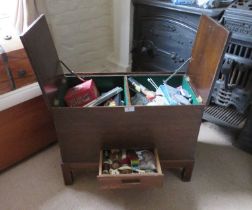 A 1930s stained oak sewing chest with green baise interior, 2ft (61cm) wide.