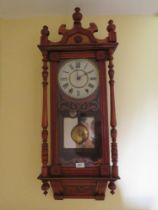 An early 20th century eight day striking English wall clock, enameled dial with Roman numerals,