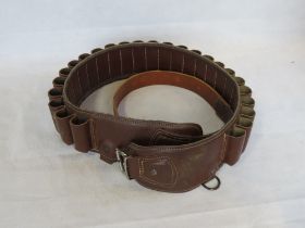 A brown leather cartridge belt made by El Caballo (Spain).