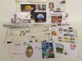 A quantity of first day covers including commemorative coin packs.
