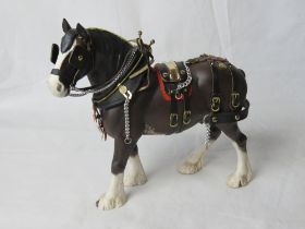 A Beswick shire horse in harness.