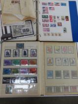 Two albums of assorted world stamps.