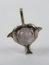 A dolphin and rose quartz pendant, 3cm in length.