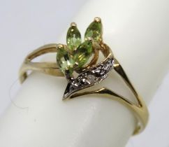 A 9ct gold peridot ring of floral cluster form with single diamond to leaf below, stamped 9k 375,