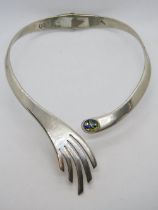 A Mexican silver hinged collar necklace with foil glass cabachon upon,