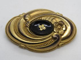 A gold plated onyx mourning brooch, 4.1cm wide, 6.7g.