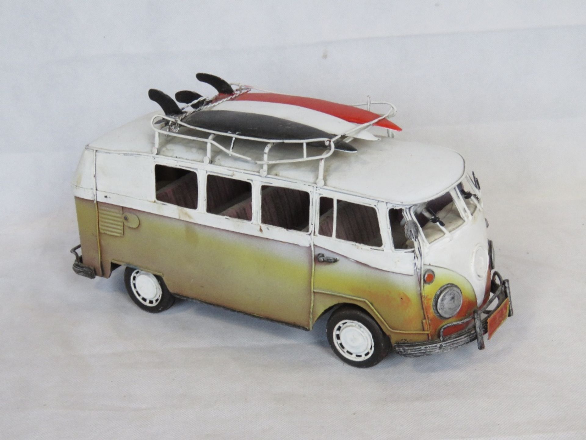 A contemporary large scale metal model of a VW Camper van.