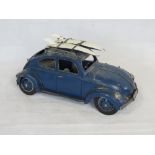 A contemporary large scale metal model of a VW Beetle.