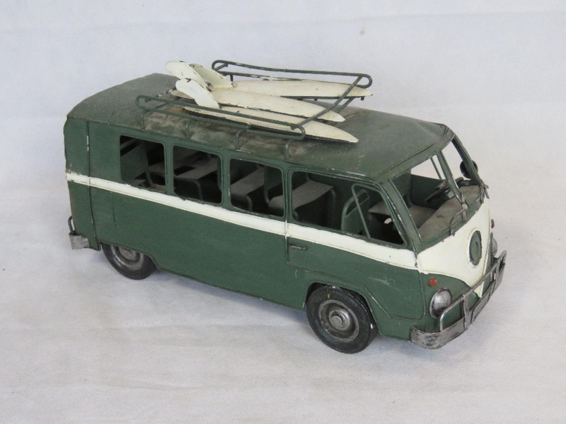 A contemporary large scale metal model of a VW Camper van.