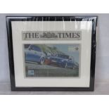 A framed BMW themed newspaper article.