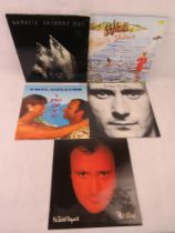 Three Phil Collins records and two Genesis records; No Jacket Required, A Groovy Kind of Love,