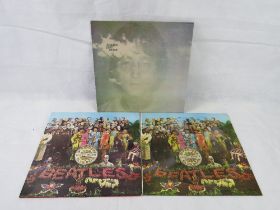 Records; John Lennon Imagine and two copies of The Beatles Sgt Peppers Lonely Hearts Club Band.