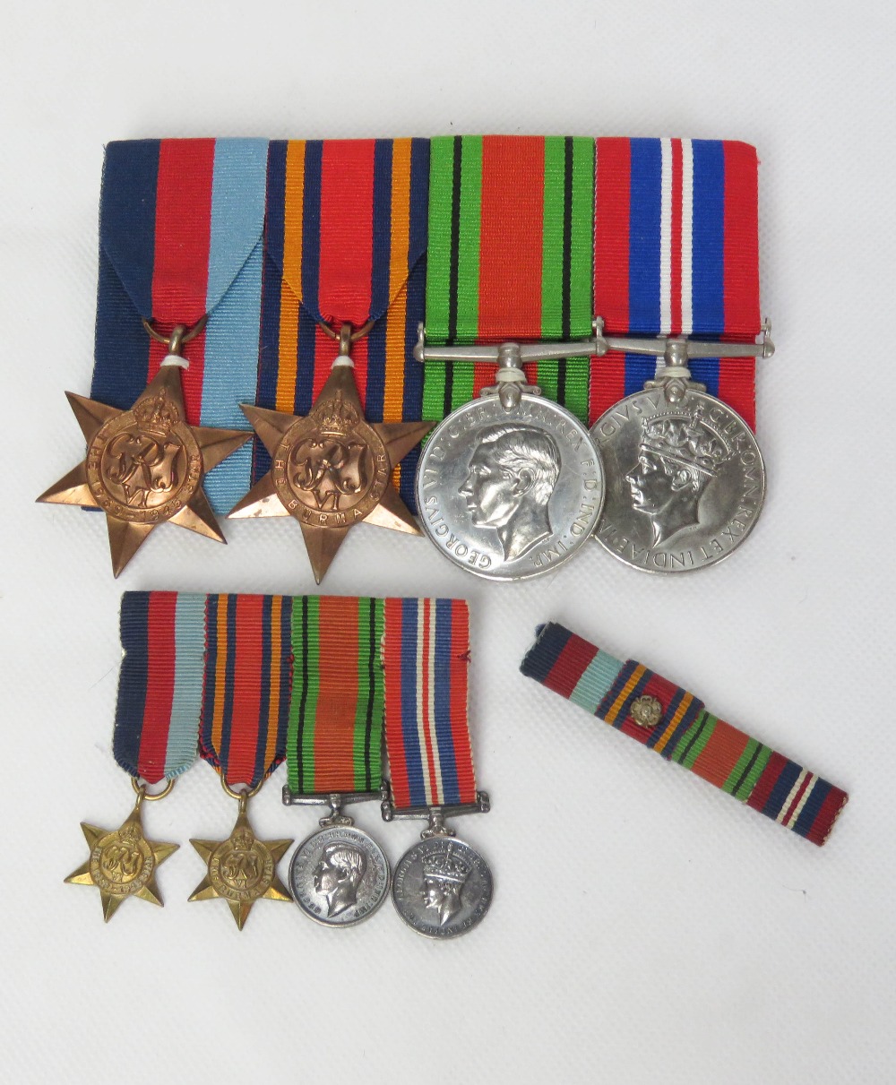 A WWII medal set with ribbons and matching miniature set. Unengraved.