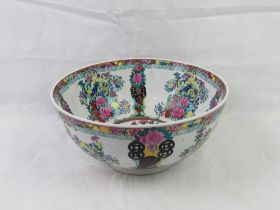 A large contemporary Oriental style fruit bowl, white ground with pink famille rose decoration,