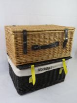 Two wicker picnic baskets, one for Selfridges.
